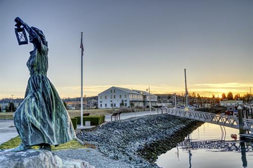 A statue at the Anacortes Marina sits in front of the new Samish HHS building.